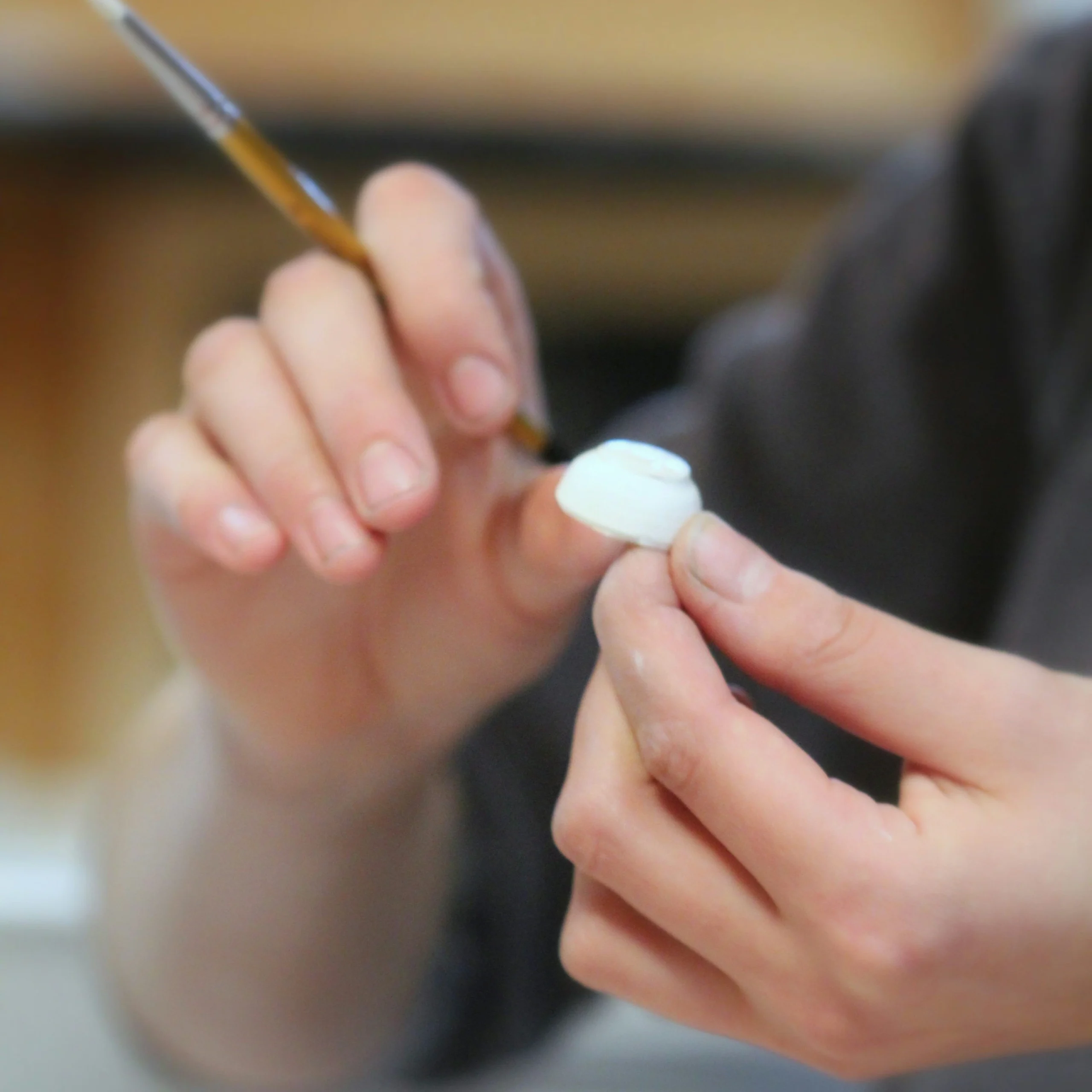 Person working calmly with cream glue