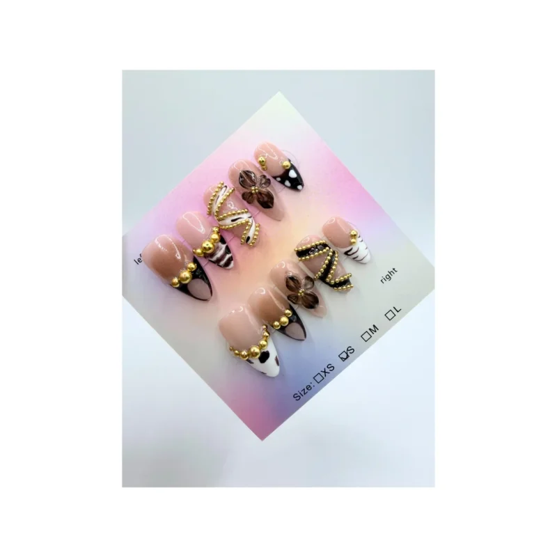 Designed with a nude base, brown and black abstract tips, elegant gold bead chain accents, and 3D translucent brown flower charms, this set blends modern art with feminine detail.