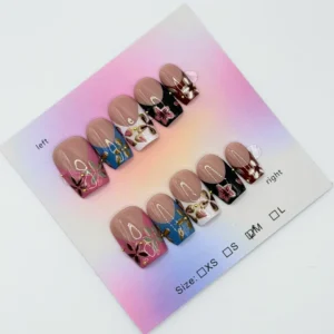 Set of short square press‑on nails with a nude base and colorful floral French tips in pink, blue, white, and black, displayed on a pastel gradient backing card.