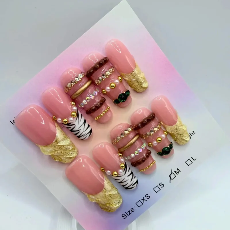 Handmade 3D-pink and gold coffin press-on nails with zebra print and emerald charms
