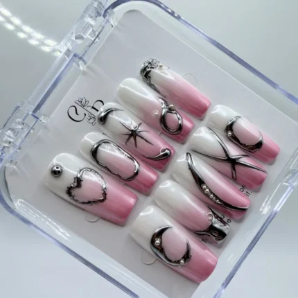 3cm long square press-on nails featuring pink and white aura ombre base with 3D silver chrome metallic heart and star designs in a clear storage box.