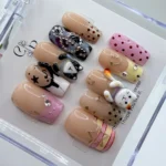 Hand painted 3d kawaii boba cat press on nails set with miniature sculpted bubble tea cups and cute kitten faces.