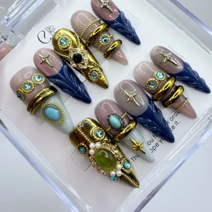 Armor- Press- On -Nails Luxury armor press on nails featuring heavy 3D metallic baroque gold plate details over a sleek base.