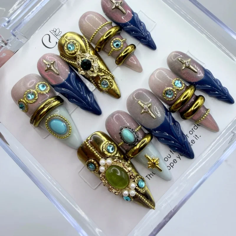 Luxury armor press on nails featuring heavy 3D metallic baroque gold plate details over a sleek base.