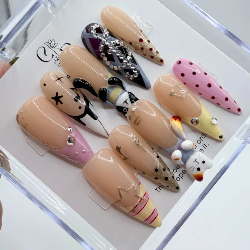 Handmade pastel anime press on nails featuring cute hand painted characters and 3D heart accents.
