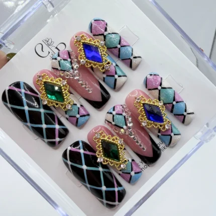 Luxury royal harlequin press on nails featuring a vintage diamond pattern with gold accents.